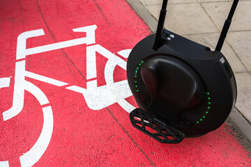 Modern unicycle on bike path in urban setting during daylight © ir1ska
