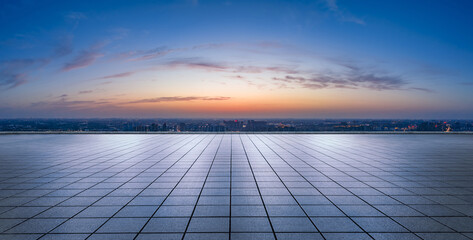 Empty square floor and city skyline with beautiful sky clouds at night