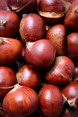 Fototapeta premium Full frame macro shot of chestnuts. Food background.