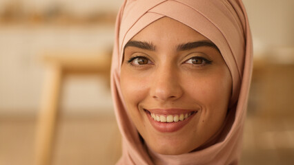 Pensive thinking dreaming woman in hijab look away think looking at camera happy toothy smiling Arabian at home portrait Islamic lady Muslim Indian girl female face close up business businesswoman
