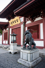 Bronze lions act as temple guardians at Yunxiang Temple in Nanxiang Water Town, Shanghai, China