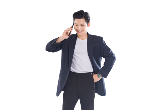 Asian businessman typing message, confident expression in modern office