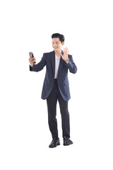 Full-body seated portrait of Asian businessman thinking during break, relaxed expression