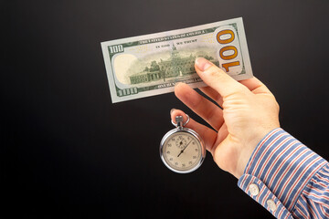 mechanical stopwatch and dollars in man hand. Part time accuracy for business. business and finance...