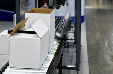 Cardboard boxes on conveyor belt. parcels transportation system concept	