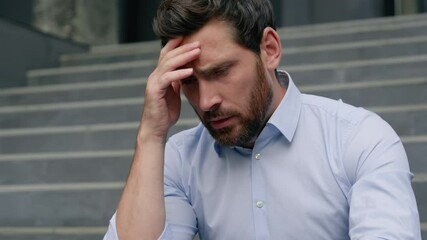 Stressed fired business man upset frustrated grief businessman upset in city middle-aged male entrepreneur suffering holding head headache financial crisis sad thinking close face with hands migraine - Powered by Adobe