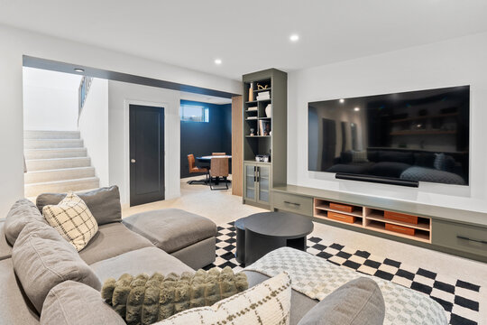 Living room with a large flat screen TV and a couch