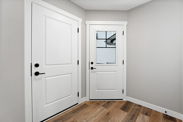 White door with a window in the middle of it