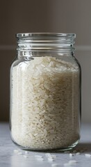 Glass Jar Filled with Uncooked White Rice Grains