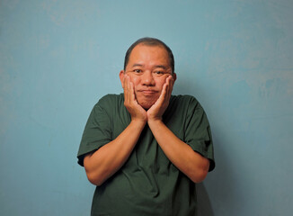 Surprised Man Touching Cheeks with Both Hands