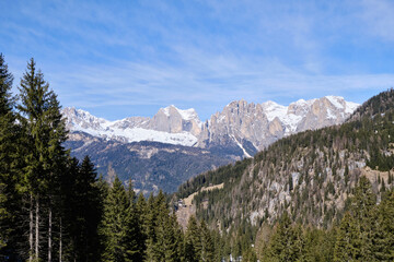 Obraz premium March 2025: Scenic view of snow covered mountains against sky, Fassa Valley.