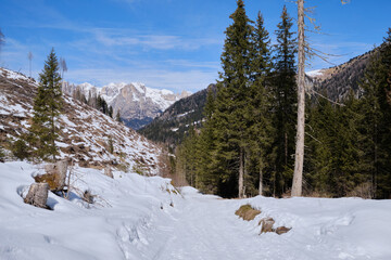 March 2025: Scenic view of snow covered mountains against sky, Fassa Valley.