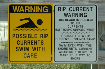 Rip tide warning sign at the ocean beach