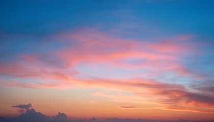 twilight sky with effect of light in pastel pink coral orange blue tones colorful sunset of soft clouds background vertical