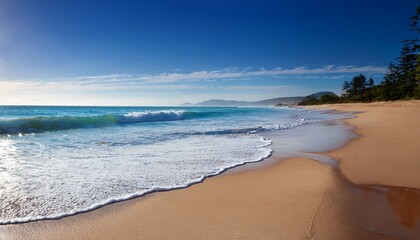 Obraz premium tranquil beach scene with gentle waves lapping on sandy shore