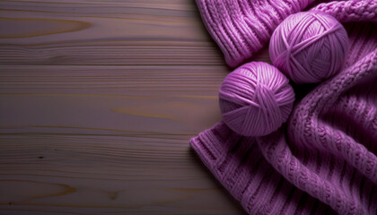Knitting wool yarn balls in on a wooden table with copy space. Cozy knitting scene with warm texture, ideal for craft, handmade, or winter-themed designs.
