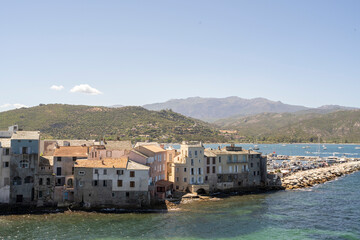 A charming coastal town featuring colorful buildings, crystalclear waters, and breathtaking...