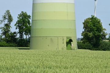 Foundation of a steel tower of a wind turbine in a cornfield
