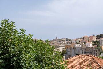 A stunningly picturesque view of a vibrant city skyline featuring traditional buildings alongside...