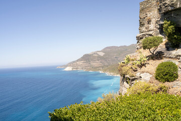 A stunning view of a coastline with impressive cliffs and vibrant blue waters, inviting exploration...