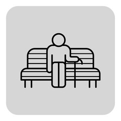 Senior man seated comfortably on sofa while holding cane. Relaxation and moments of rest concept