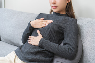 Acid reflux disease, suffer asian young woman have symptom gastroesophageal, esophageal, stomach...