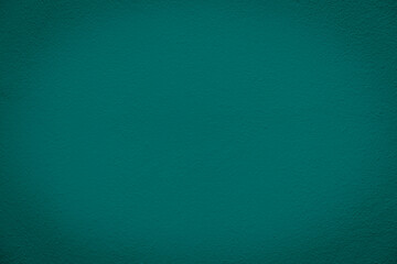 Vignette Abstract Surface Texture of Green Grunge Concrete Wall with Variations in Color Depth and Subtle Grain Patterns