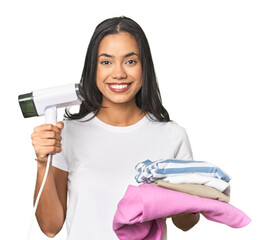 Positive Latina using a steam iron on clothes