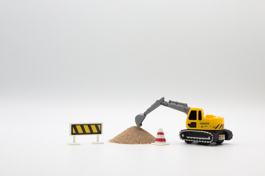 Juguetes trabajadores - Excavadora cargando arena