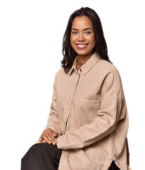 Seated Filipino woman looking at camera