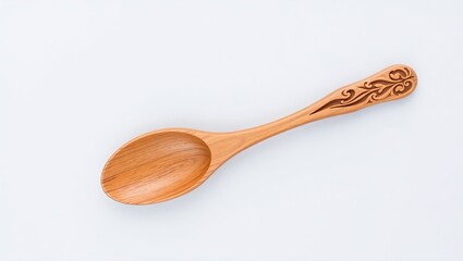 Wooden spoon with floral carvings on handle and bowl, diagonally placed on light gray background. Rich wood grain and warm tone highlight rustic craftsmanship and decorative artistry.

