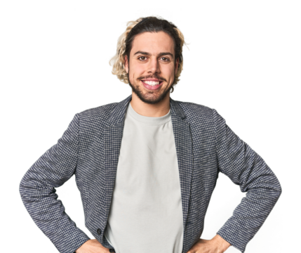 Young businessman in casual blazer confident keeping hands on hips.