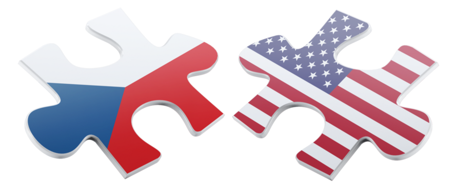 Two puzzle pieces, one featuring the Czech Republic flag and the other the American flag, represent the connection between these two countries using international relations.