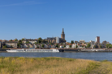 A scenic panorama of Nijmegen, Netherlands, reveals its historic skyline featuring a prominent...