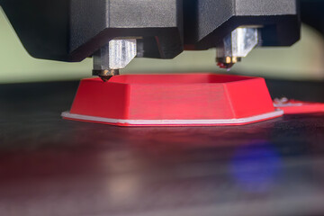 Close up scene the 3D model operation by additive manufacturing by 3D printer machine.