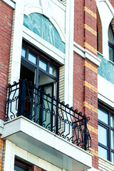 Balcony with black cast iron railing on old European style house