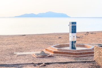 An old beach shower on the grounds of an abandoned hotel on the Red Sea coast
