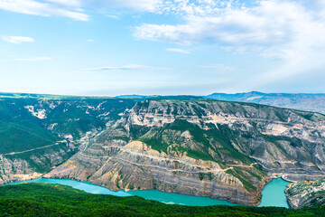 Panoramic landscape of a deep picturesque canyon of the Caucasian mountains of Dagestan and the azure mountain river Sulak. Russia