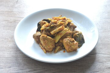 spicy stir fried bamboo shoot and chicken with curry on plate