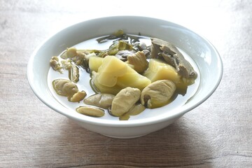 boiled pickled cabbage with pork innard in clear soup on bowl 