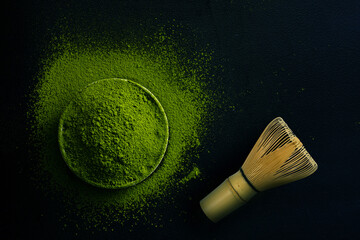 The Matcha green tea on a dark background, shot in still life style.