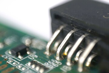 Close-up shot of a circuit board connector, showcasing intricate details and soldering points....