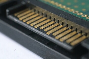 Close-up macro shot of a hard drive connector pins.  Ideal for technology, electronics, and...