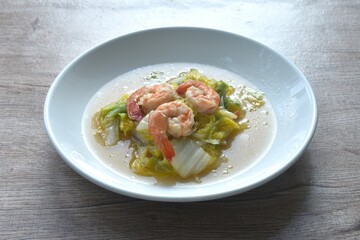 fried slice cabbage with shrimp in soy sauce on plate