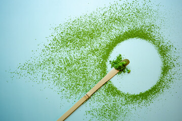 The Matcha green tea on a pastel green background, shot in still life style.