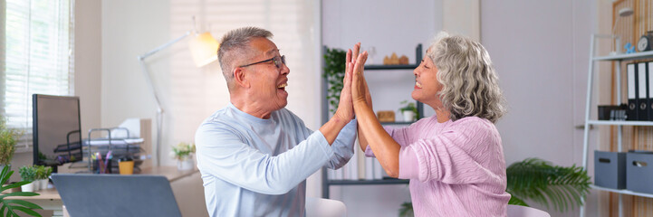 Cheerful Senior Asian Couple Giving High Five at Home Office Celebrating Success Together Happy Old...