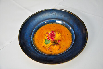 Delicious Indian Fish Curry in a Blue Bowl