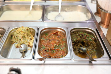 Indian Restaurant Buffet Food Chaat Dishes in Stainless Steel Trays