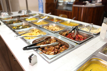 Indian Restaurant Buffet Food Display with Various Dishes