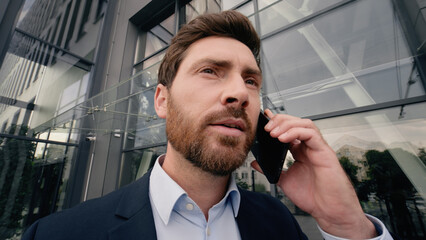 Middle-aged Caucasian business man screaming yelling angry to mobile phone talking call problem...